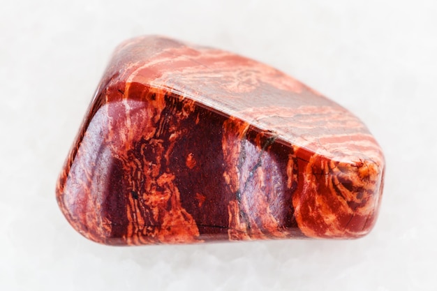 Polished Brecciated red jasper gemstone on white