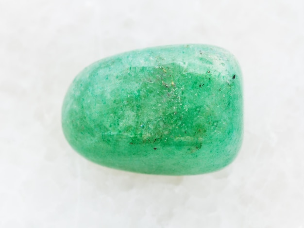 Polished green Aventurine gem stone on white