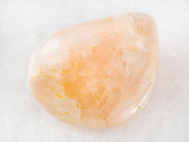 Photo polished stilbite gemstone on white