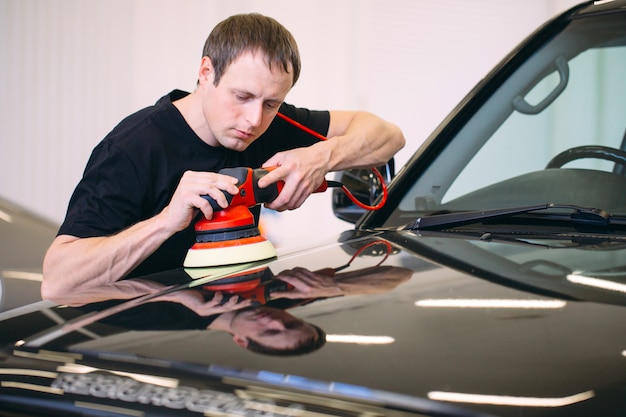 Polishing car body.