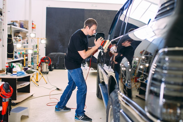 Polishing car body.