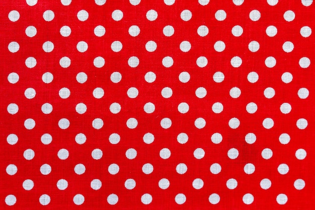 Polka dot op rode canvas katoenen textuur.