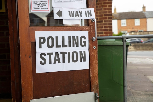 Polling station sign outside the entrance to a political voting\
location in uk