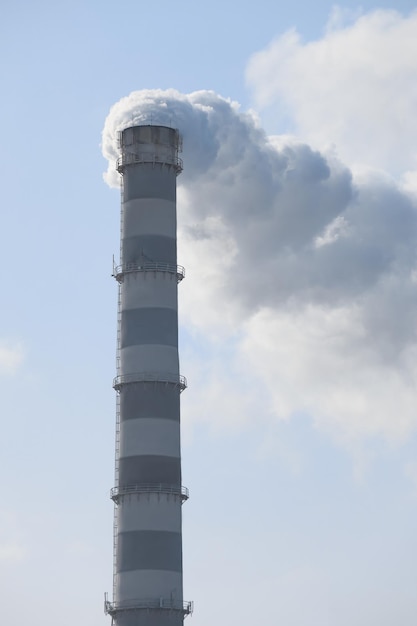 Polluting air with smoke from industrial chimney outdoors CO2 emissions