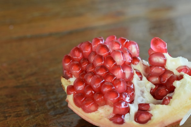 Pomegranate broken in half with red sememtes