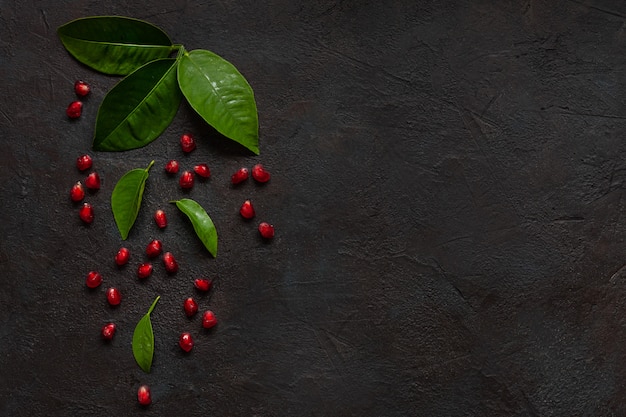 Pomegranate on dark concrete background. 