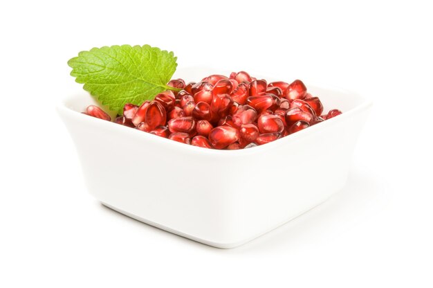 Pomegranate fruit isolated on a white surface cutout