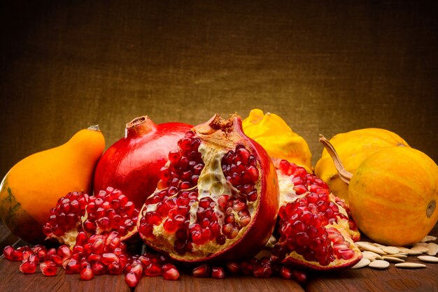 Pomegranate fruits and pumpkins