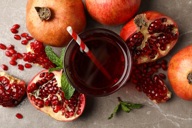 Pomegranate and juice on brown, top view