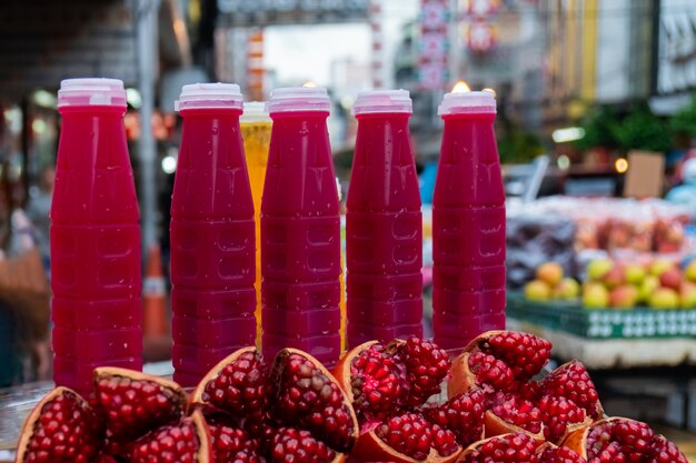 Pomegranate juice and pomegranate fruit are sold in the market.