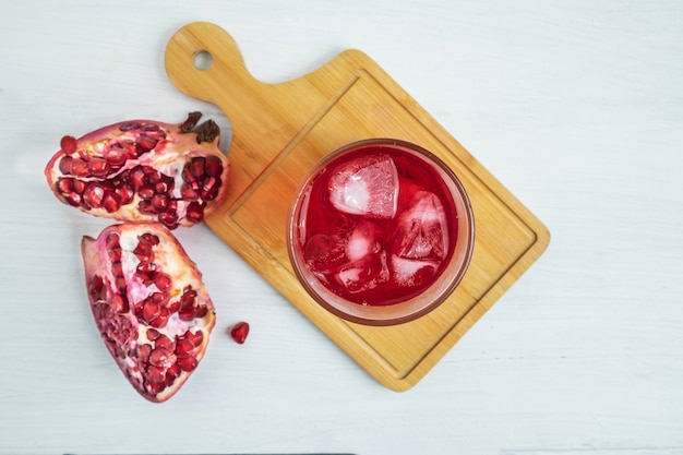 Pomegranate juice on the white table