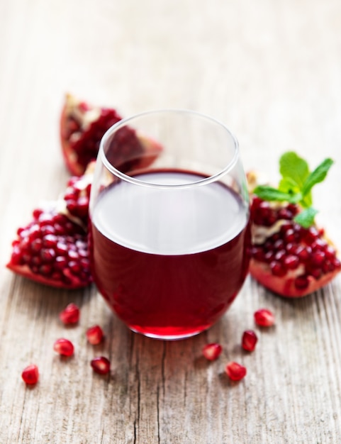 Pomegranate juice with fresh pomegranate fruits