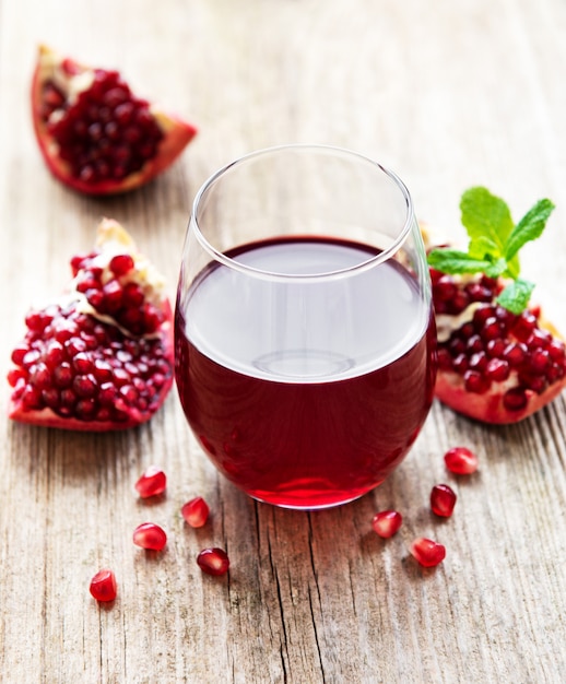 Pomegranate juice with fresh pomegranate fruits