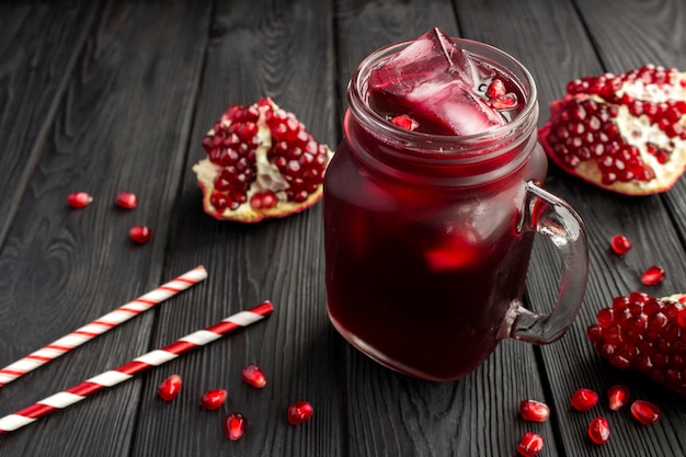 Pomegranate juice with ice in the glass