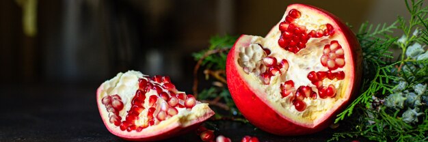 pomegranate red fruit sweet christmas dessert on the table new year treat