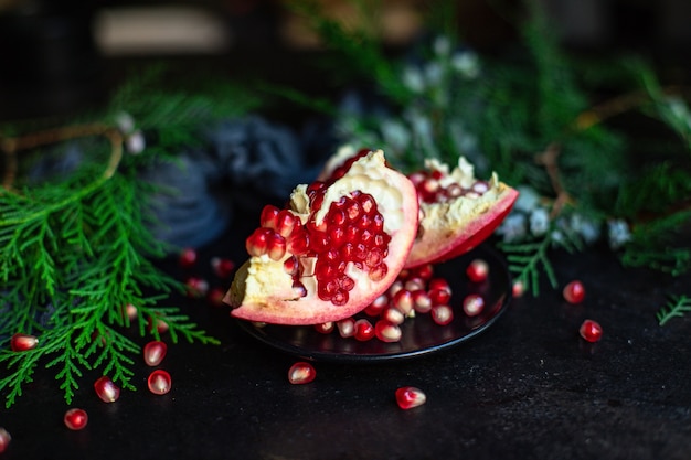 pomegranate red fruit sweet christmas dessert on the table new year treat