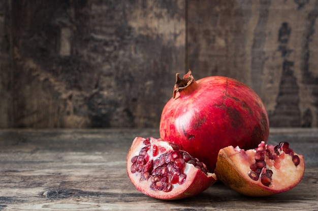 Pomegranate on rustic wooden background