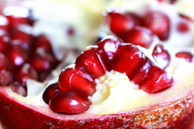 Pomegranate seed on wood background