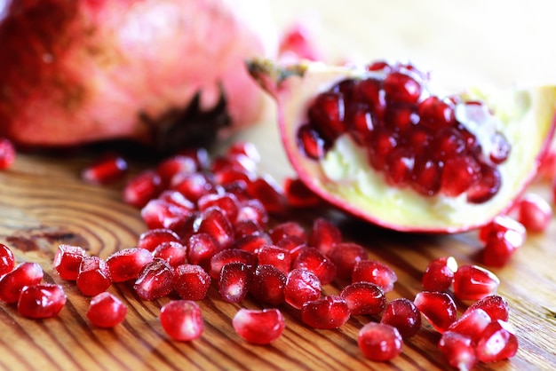 Pomegranate seed on wood background