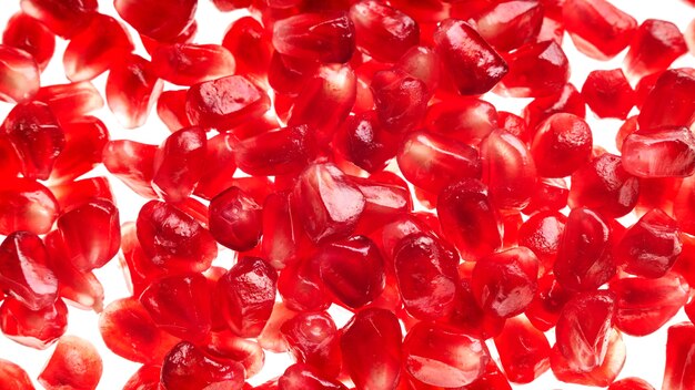 Pomegranate seeds background, top view flat lay