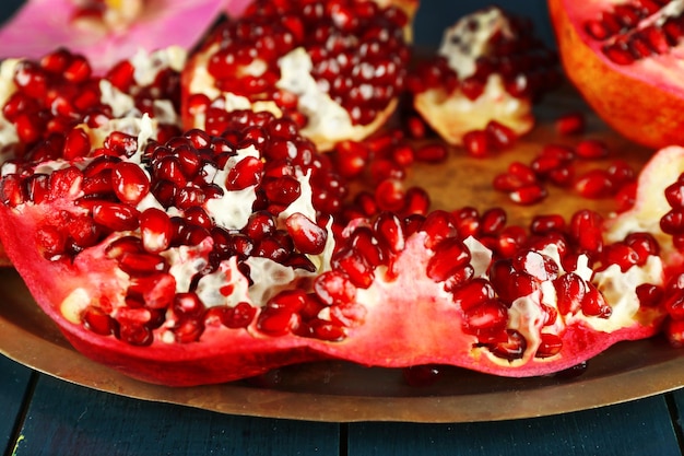 Pomegranate seeds on metal tray closeup