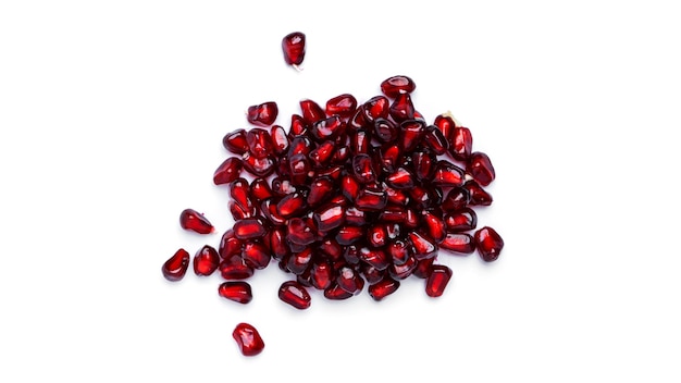 Pomegranate seeds on white background