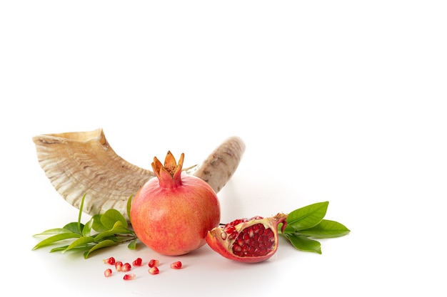Pomegranate on white background' traditional food of jewish New Year - Rosh Hashanah. Free space for text