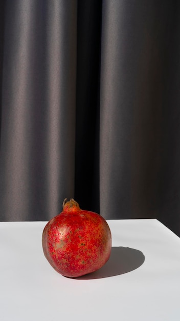 Pomegranate on white table