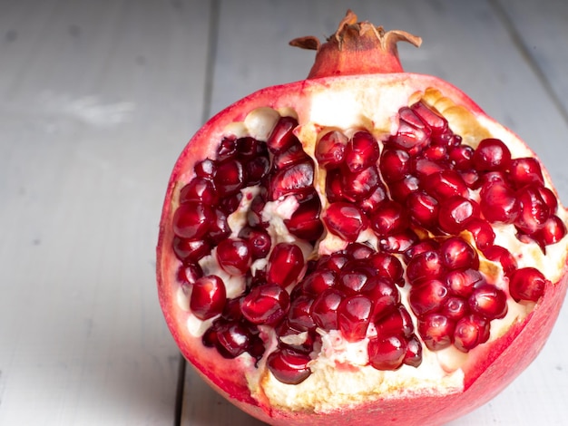 a pomegranate on wooden background