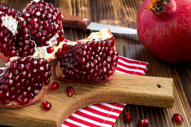 Pomegranate on the wooden cutting board