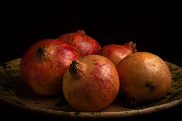 Pomegranates on an old plate.