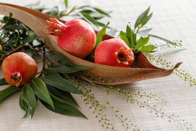 Pomegranates on the table the symbol of the Jewish new year Rosh Hashanah