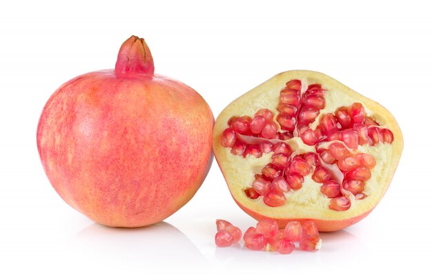 Pomegranates on white wall