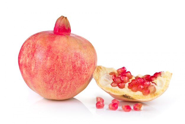 Pomegranates on white wall