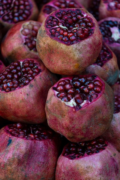 Pomegranates with peeled skin on the fruit market