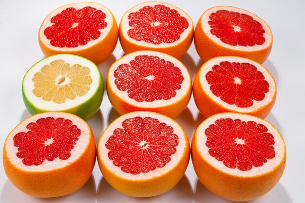 Pomelo and grapefruit juicy slices background.