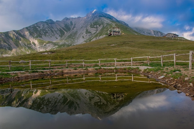 Pond for watering the cattle in the mountain