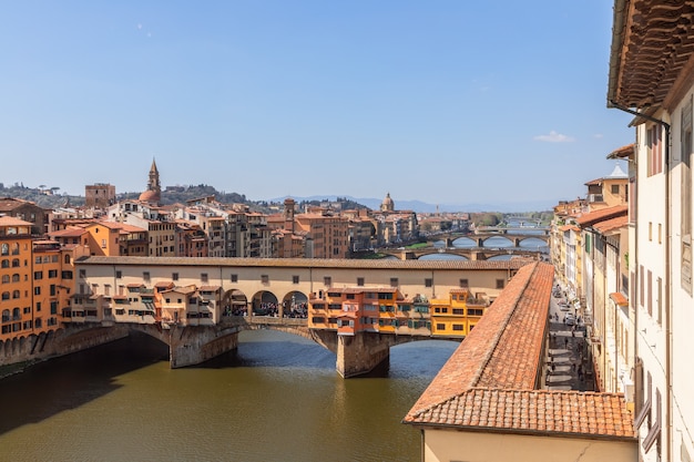 Ponte Vecchio over the Arno River and the Vasari Corridor in Florence, Italy.