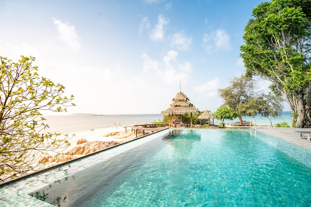 Pool over the beautiful sea view in paradise beach, summer vacation relaxing time 