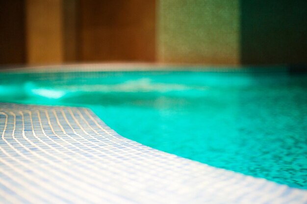 Pool closeup with mosaic rest in the spa center