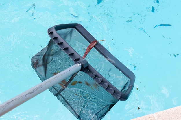 Pool Skimmer cleaning a dirty swimming pool