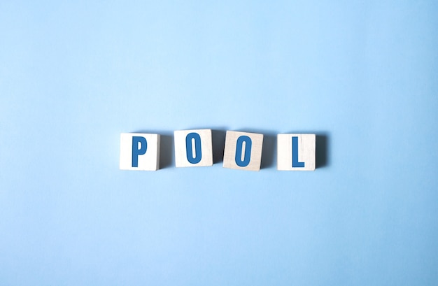 Photo pool spelled out in white alphabet blocks.