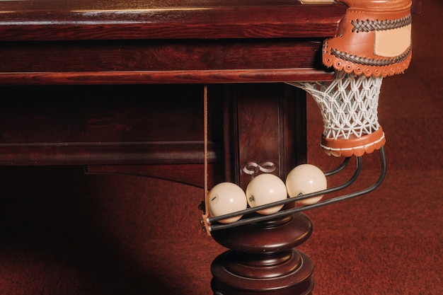 A pool table with balls that have already been played in the pool club.Playing billiards.