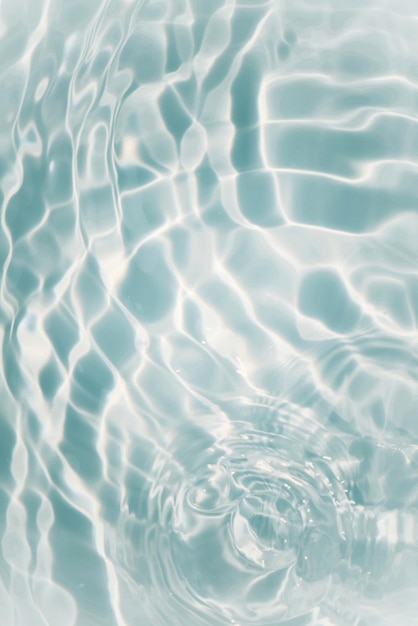 A pool with a blue water and a large ripple of the water.