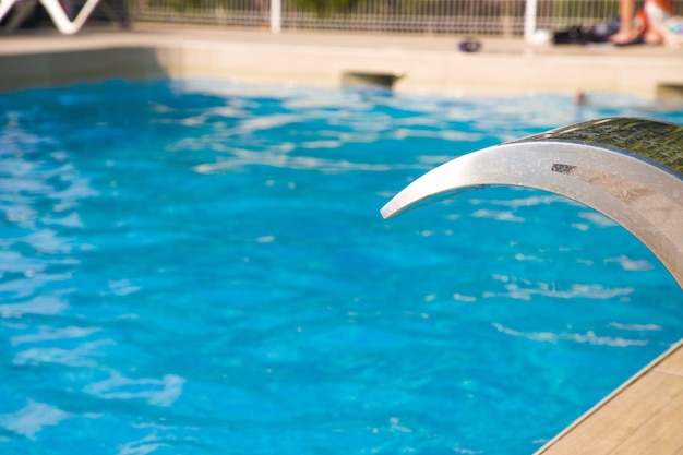 A pool with blue water in summer