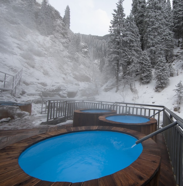 Photo pool with thermal water in the winter mountains