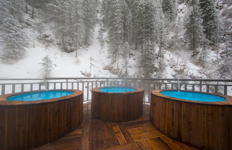 Photo pool with thermal water in the winter mountains