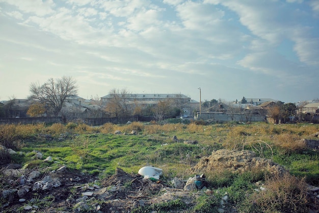 Poor district surrounded by densely polluted field