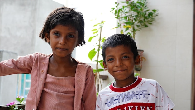 Poor siblings together outdoor image