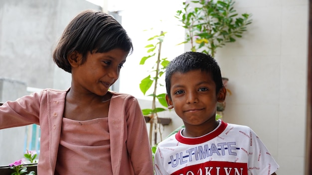 Poor siblings together outdoor image